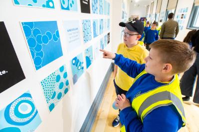 Holy Rosary Primary School students viewing the art exhibition.